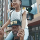 Stephen Jackson hodls the daughter of his “twin,” George Floyd, on his shoulders.